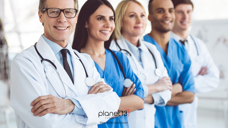 Diverse group of smiling medical professionals standing together.